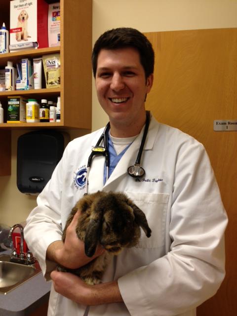 Dr. Fritz Trybus holding a rabbit