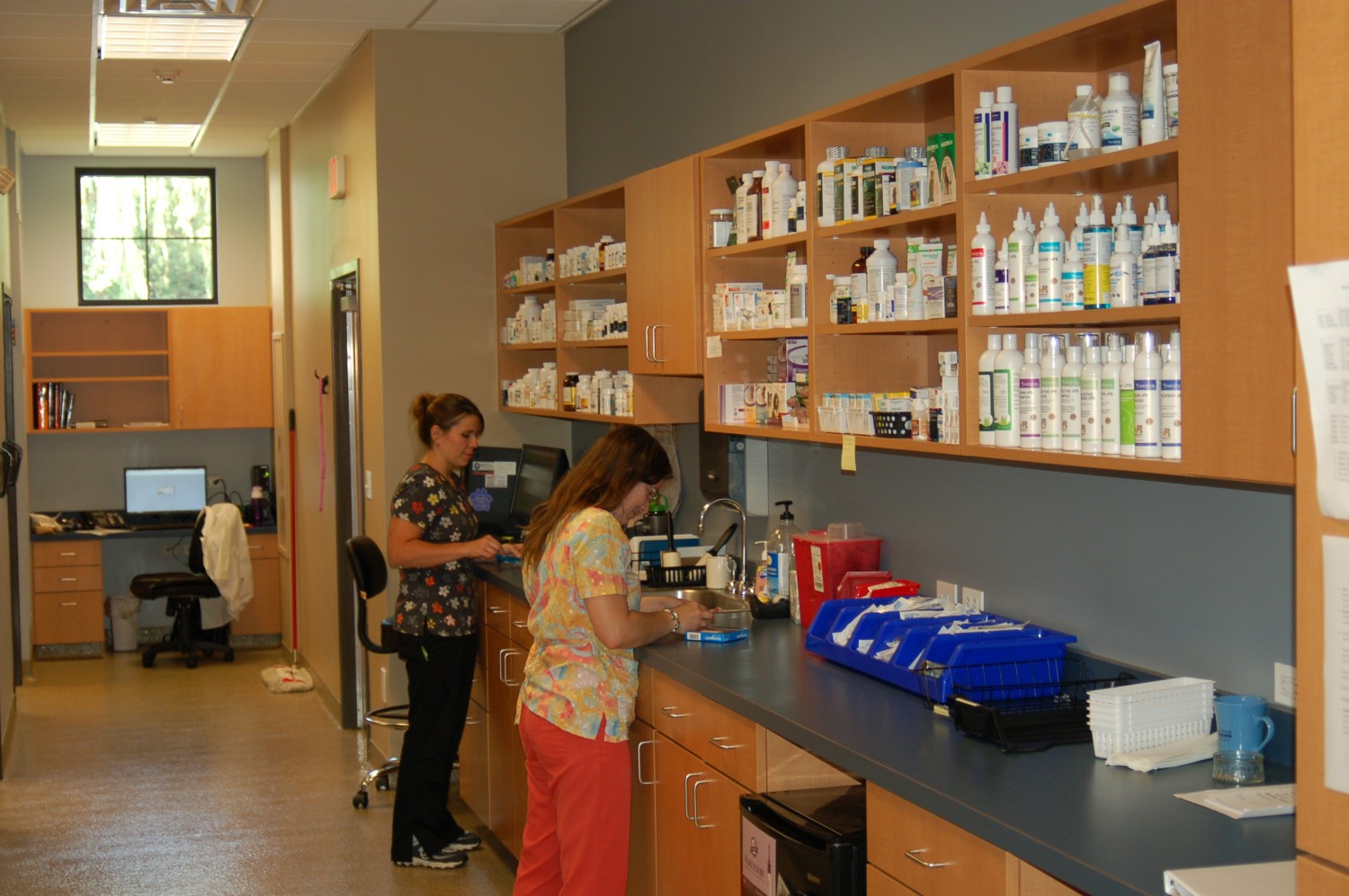 Two staff members filling prescriptions in our pharmacy